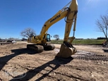 Used Excavator under blue sky